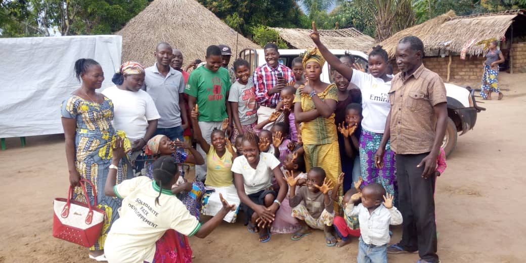 LRA returnee is surrounded by family