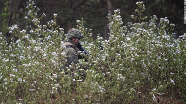 A French soldier watches the road in Baoro on Saturday, December 7. (Photo via CNN)